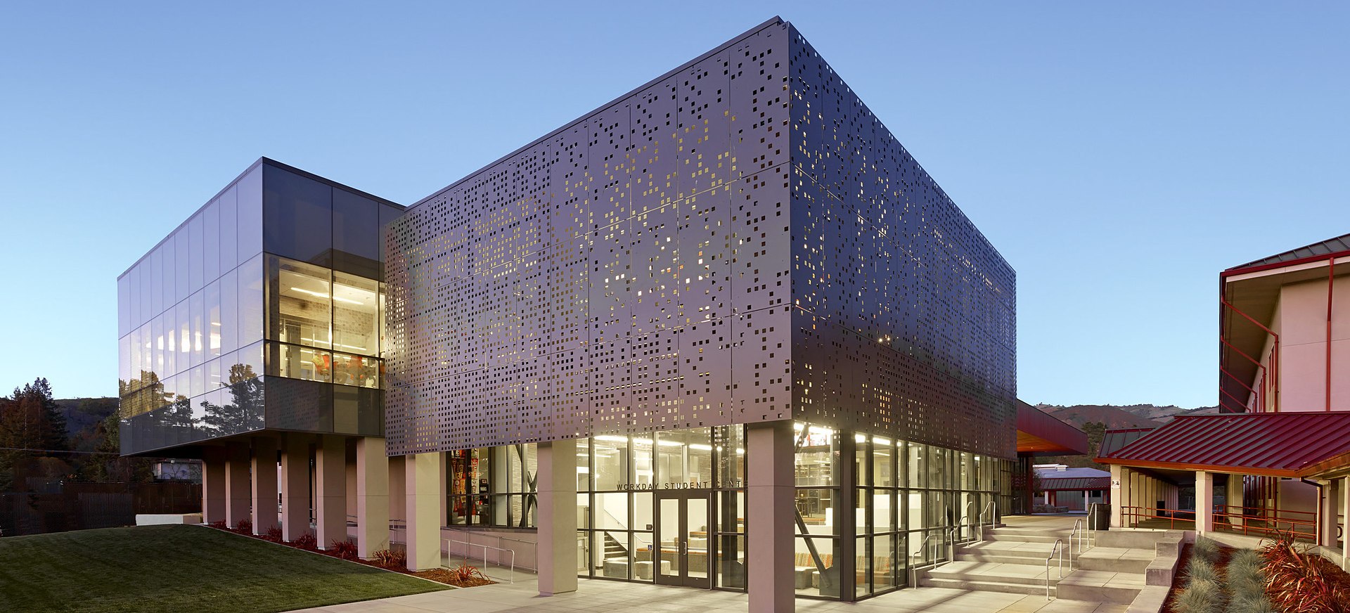 Modern high school student center building at dusk